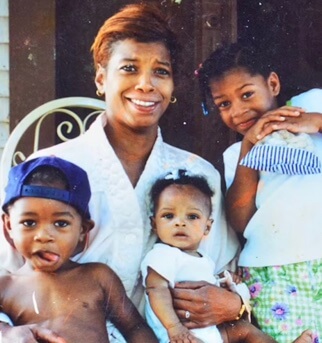 Ashley Biles Thomas with her biological mom and siblings.